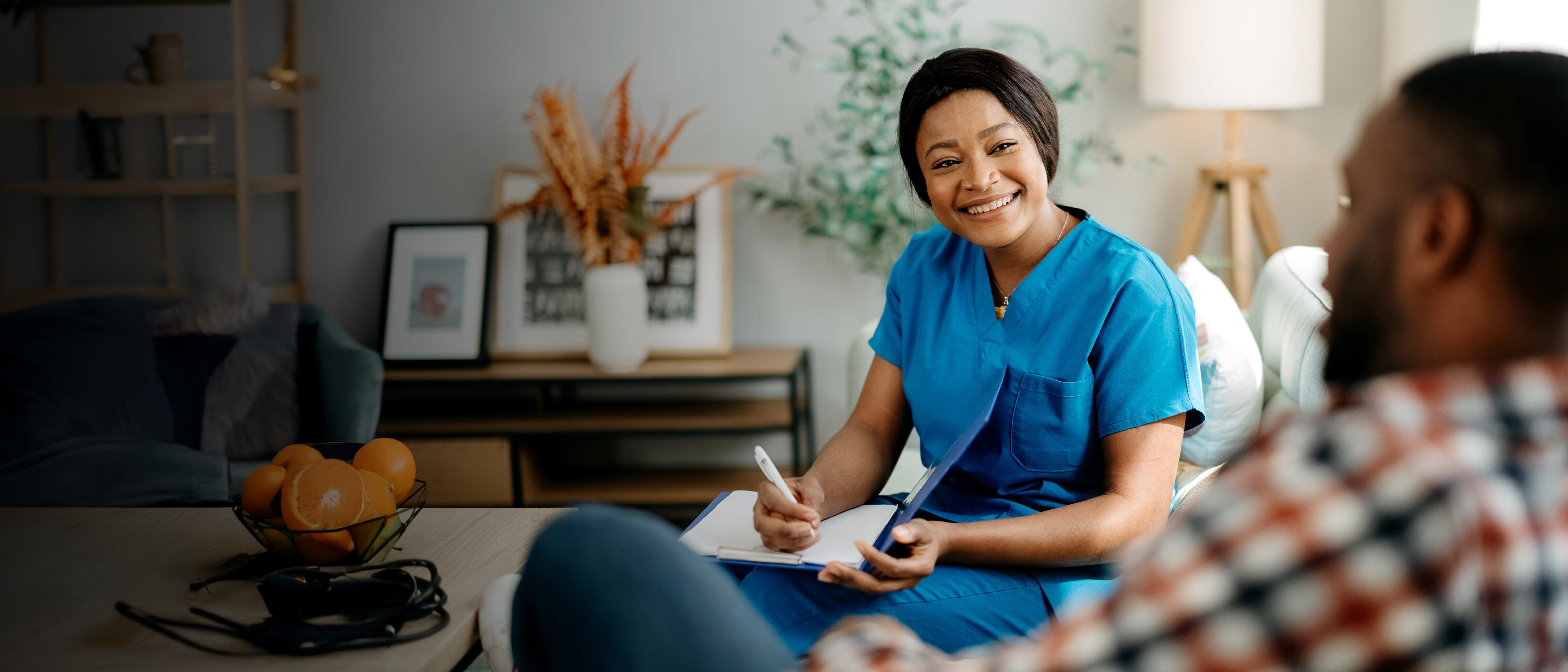 Woman writing on a notepad