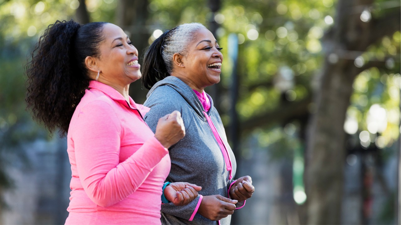 A women smiling while on a walk outside