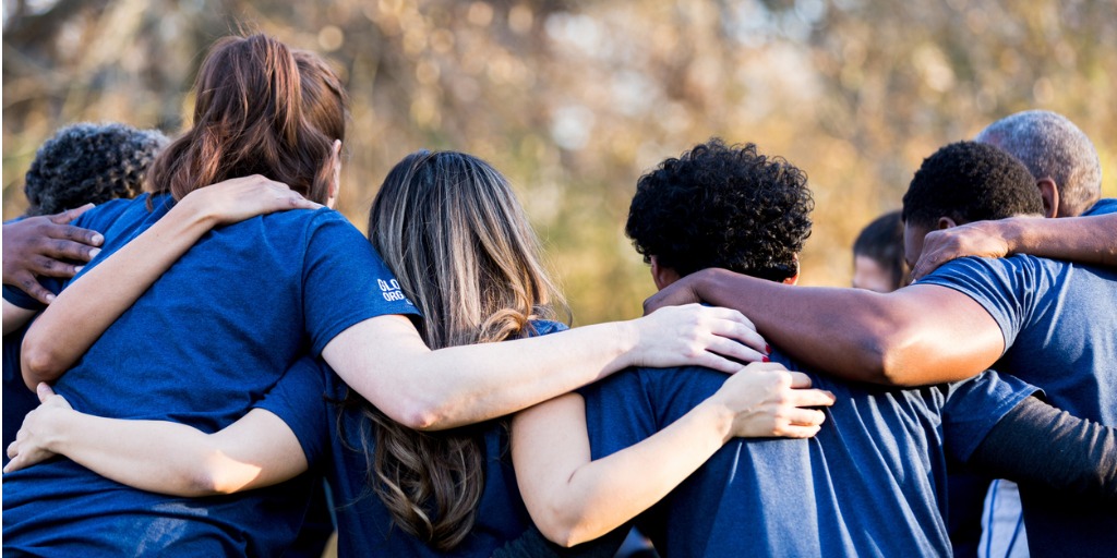 friends linking arms in unity